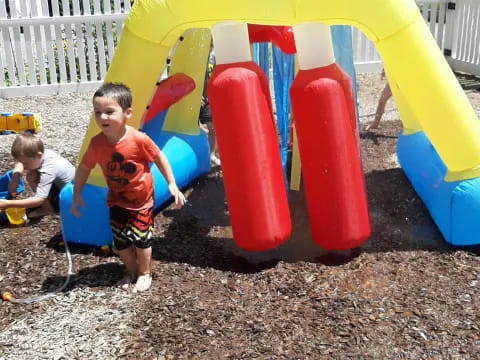 a group of kids playing in a sandbox