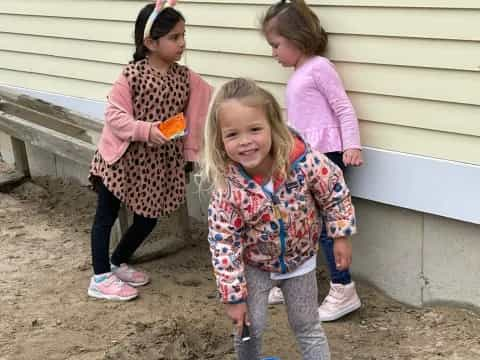 a group of girls standing outside