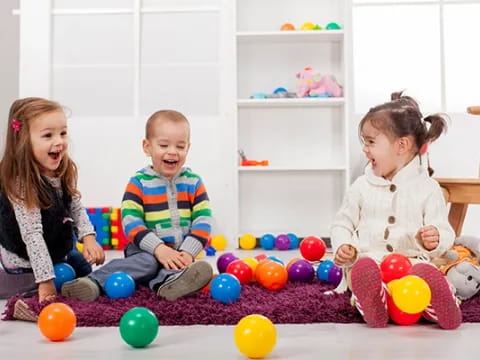 a group of children playing with balls