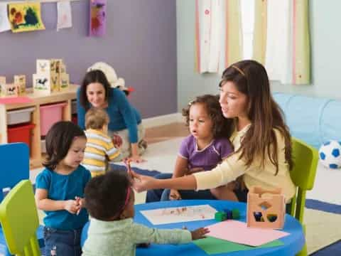 a group of children sitting in a classroom