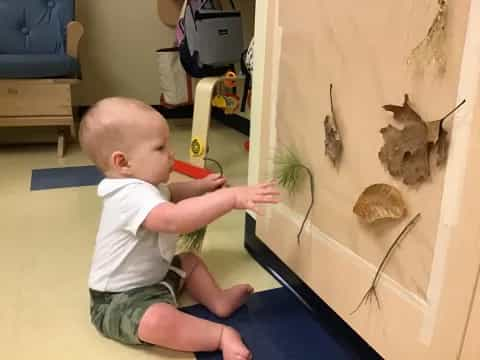 a baby playing with a toy