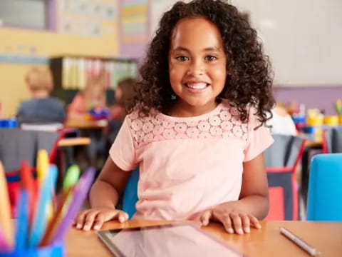 a young girl smiling