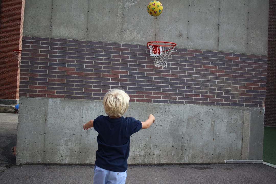 a child playing with a ball