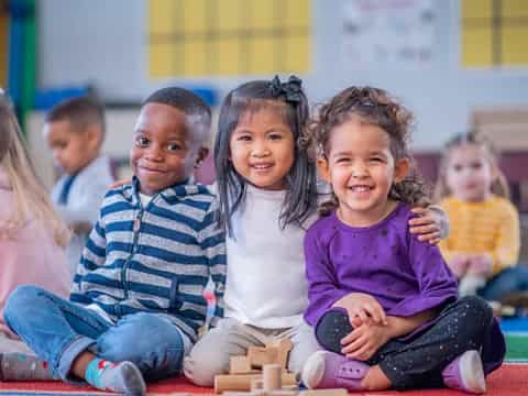 a group of children sitting on the floor