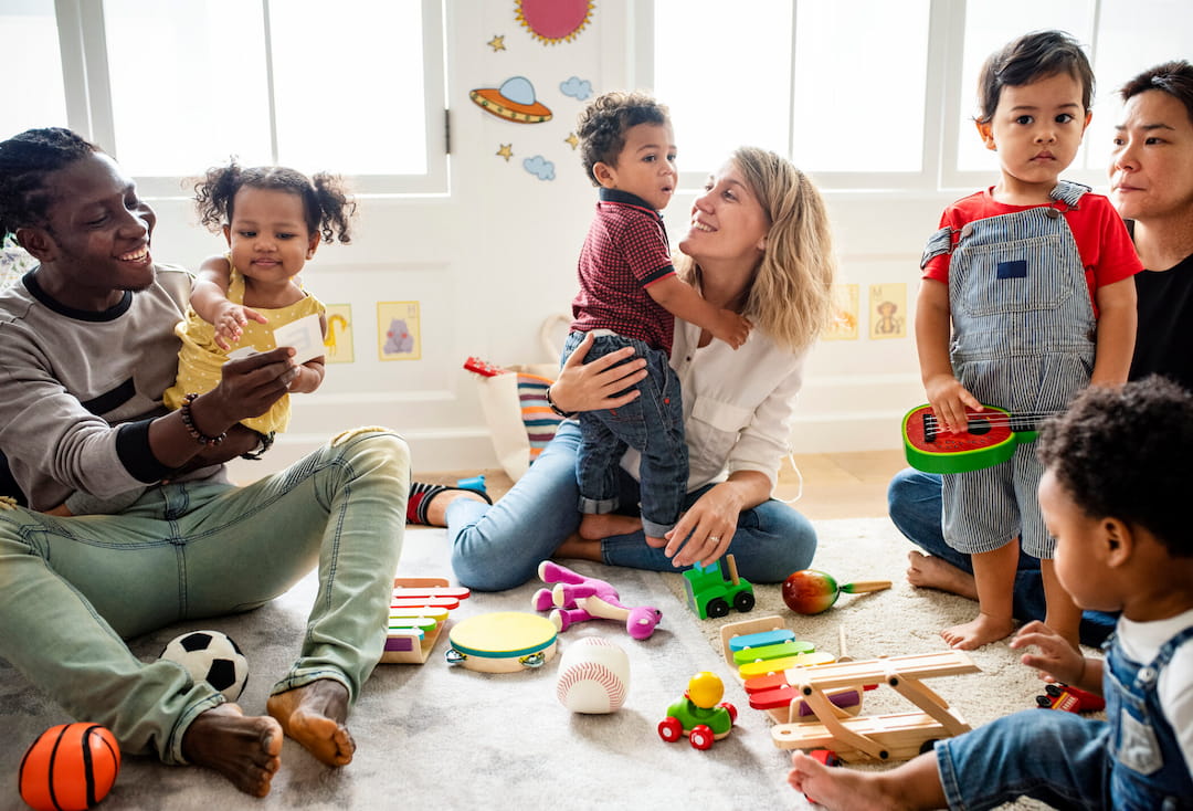 a group of people playing with toys