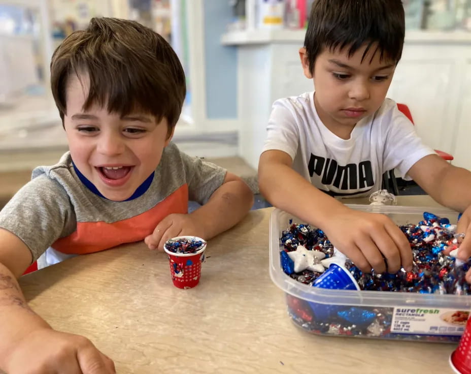 a couple of boys playing with a toy