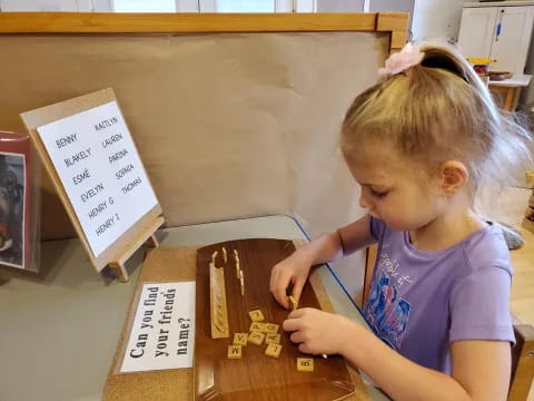 a young girl playing with a toy