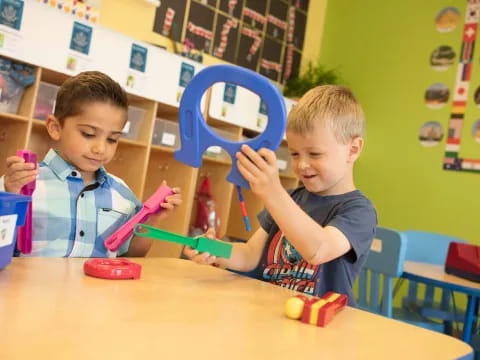 a couple of boys playing with toys