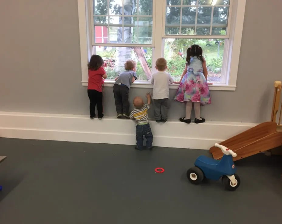 a group of children playing with toys