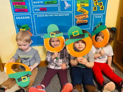 a group of children sitting on the floor with toys