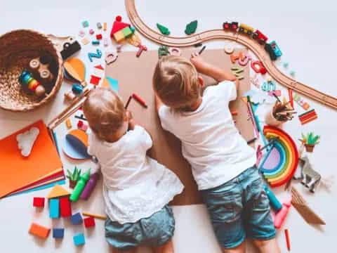 a couple of kids playing with toys