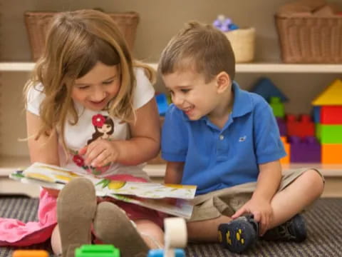 a boy and girl playing with toys