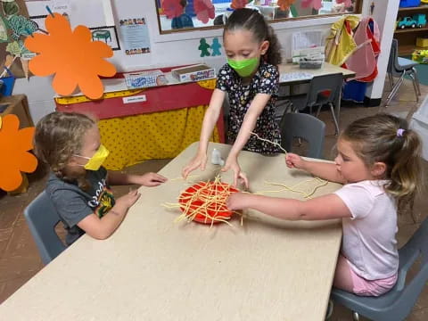 a group of children playing with toys