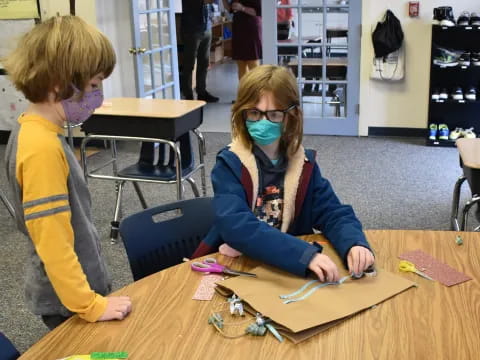 a person and a boy painting