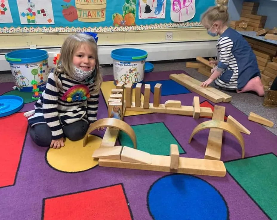 children playing with wooden blocks