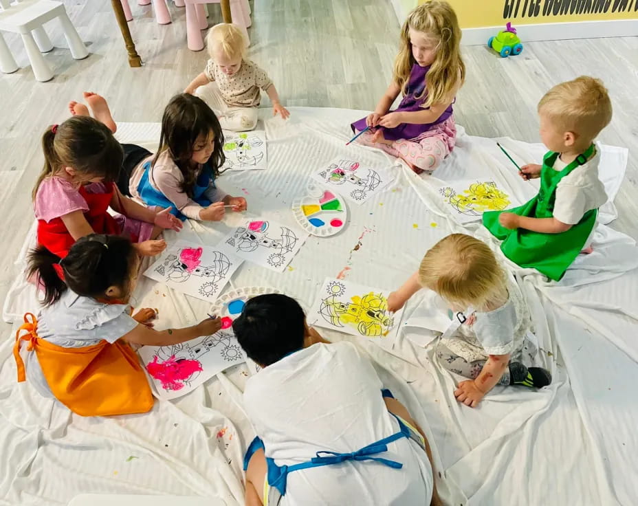 a group of children sitting on the floor