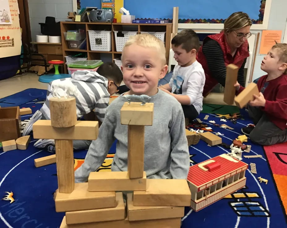 a group of children playing with building blocks