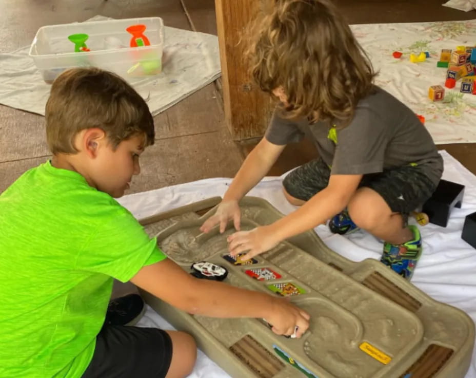 a couple of children playing with toys