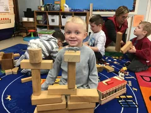 a group of children playing with building blocks