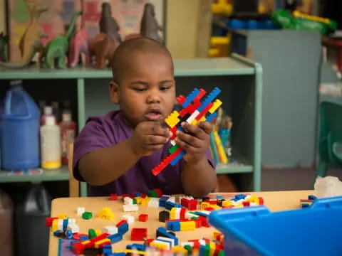 a baby playing with toys