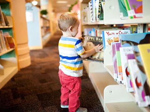 a child standing in a library