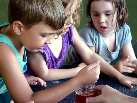 a few children playing with a toy