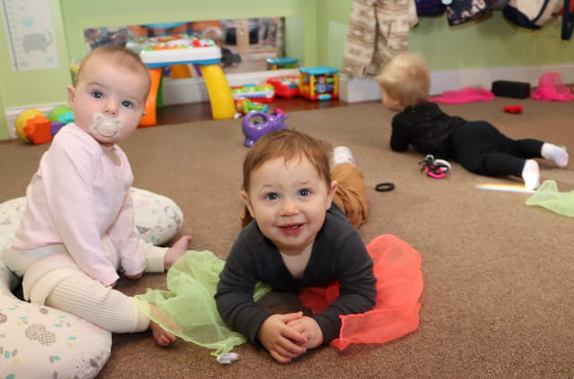 a group of children sitting on the floor