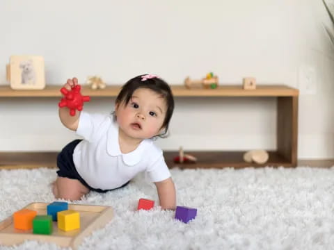 a baby playing with toys