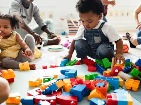 a group of children playing with toys