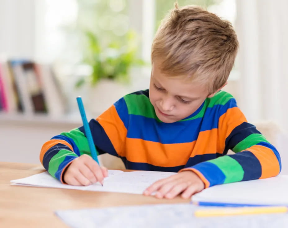 a child writing on a book