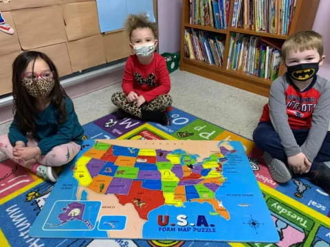 children playing with a puzzle