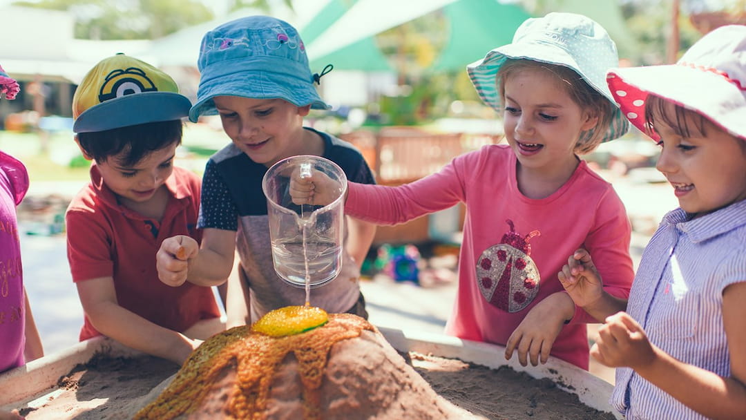 a group of kids wearing hats