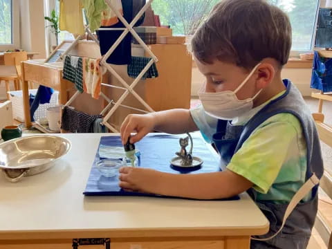 a boy sitting at a table