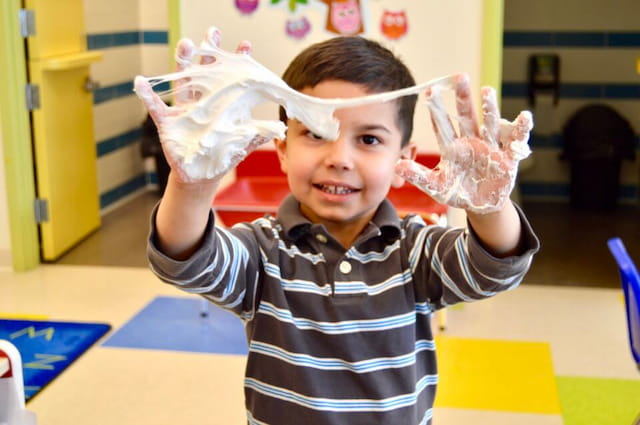 a child holding a plastic bag