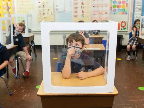 a boy sitting in a chair