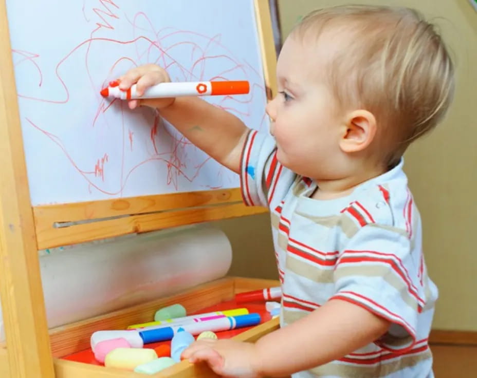 a baby playing with a toy