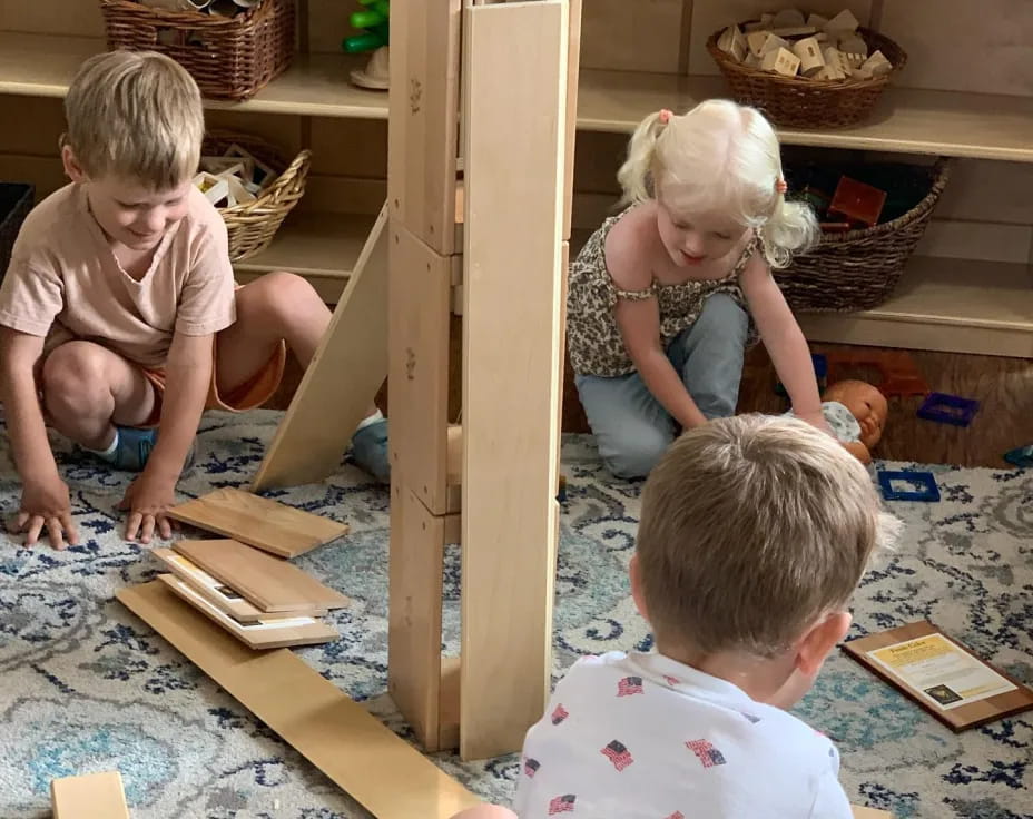 children playing with wooden blocks