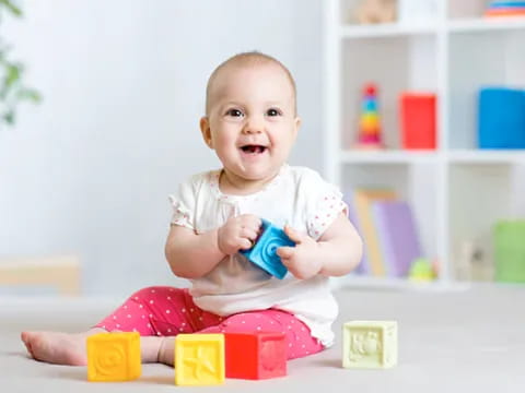 a baby sitting on a table