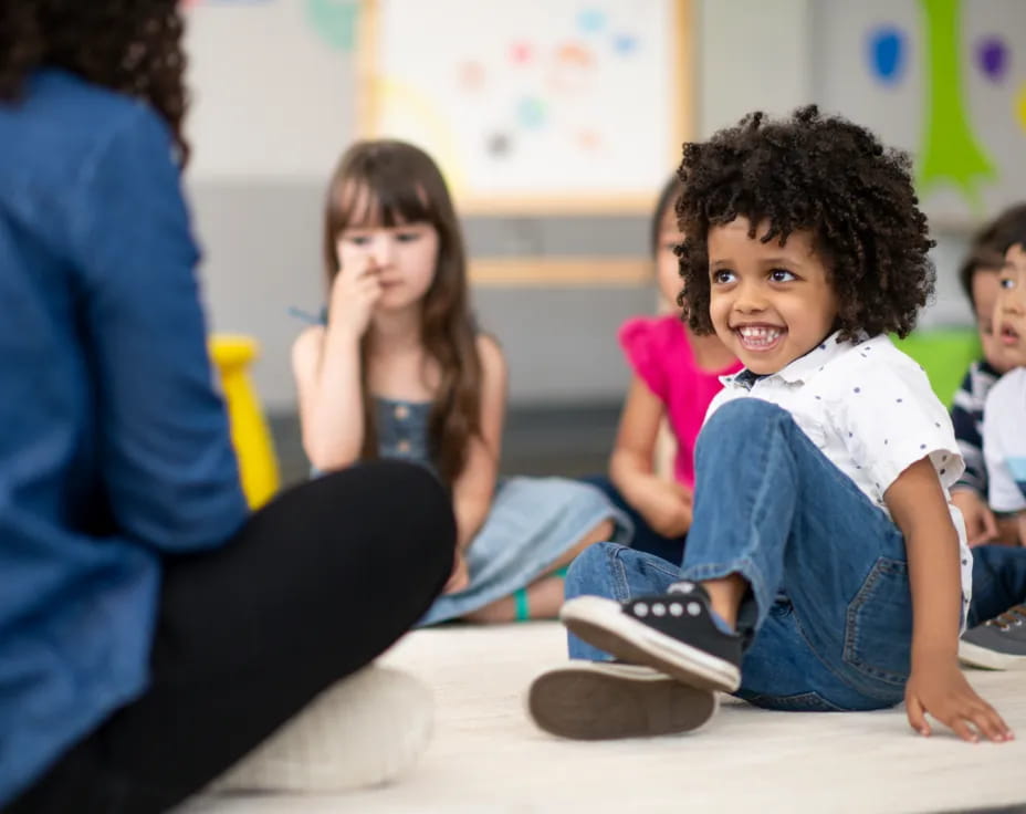 a group of children sitting on the floor