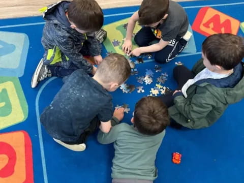 a group of children playing on a mat