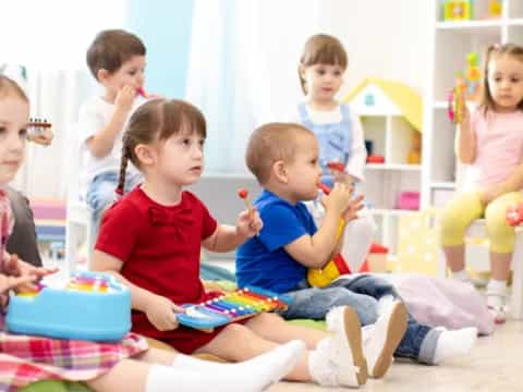 a group of children sitting on the floor