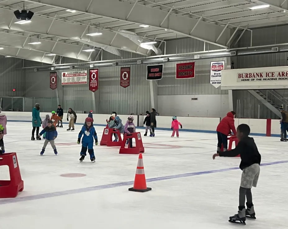 people on ice skates in an ice rink