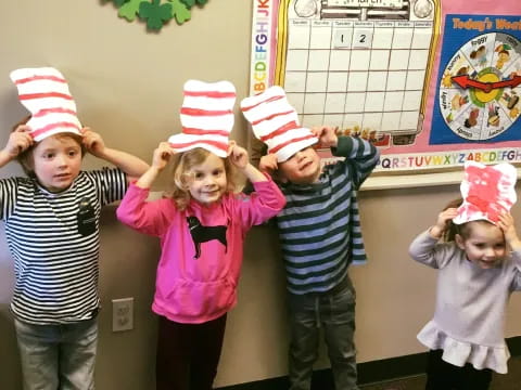 a group of children wearing party hats