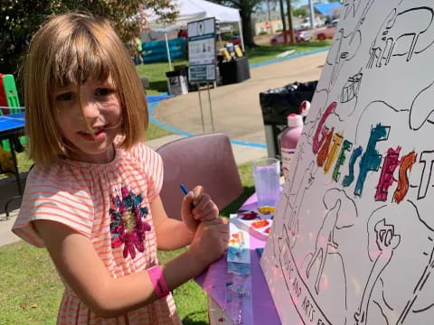 a girl painting a picture