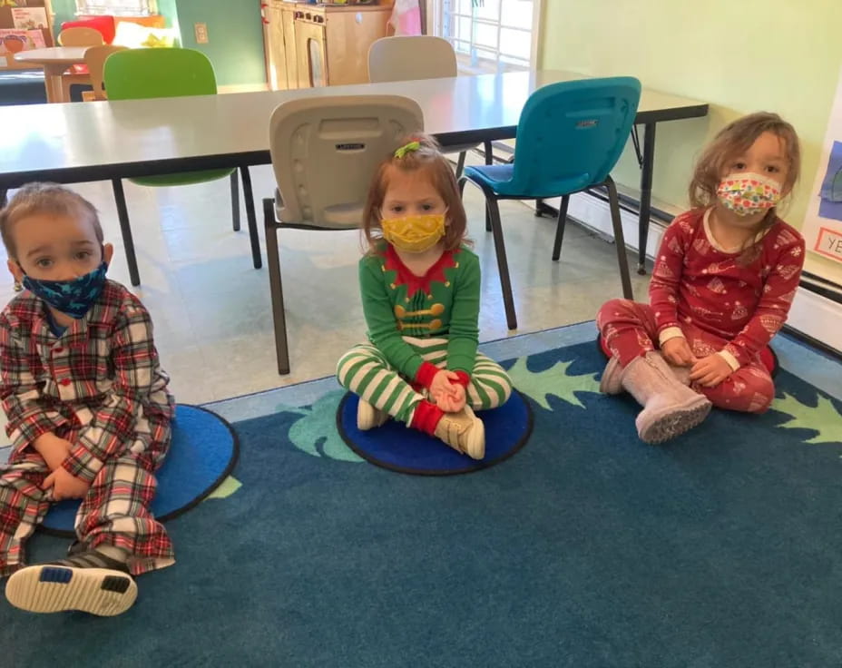 a couple of children sitting on the floor