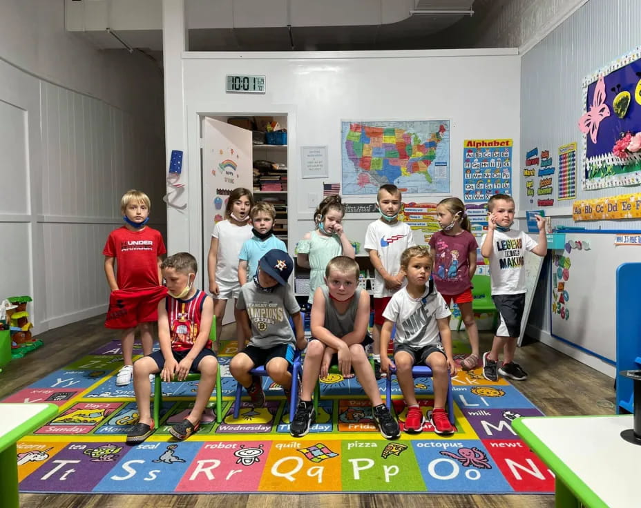 a group of kids posing for a photo