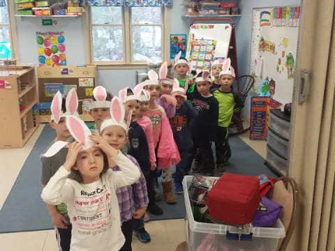 a group of children wearing bunny ears