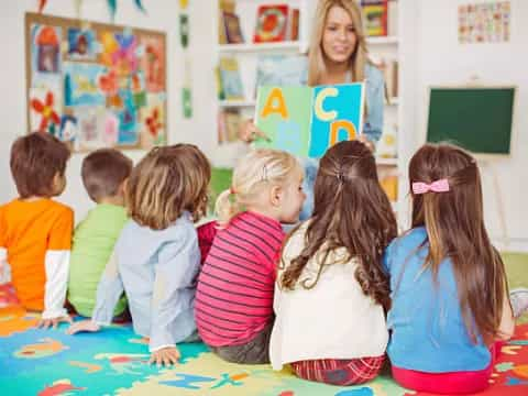 a group of children sitting on the floor