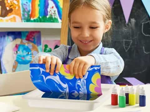 a young girl painting