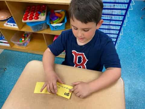 a boy sitting on the floor